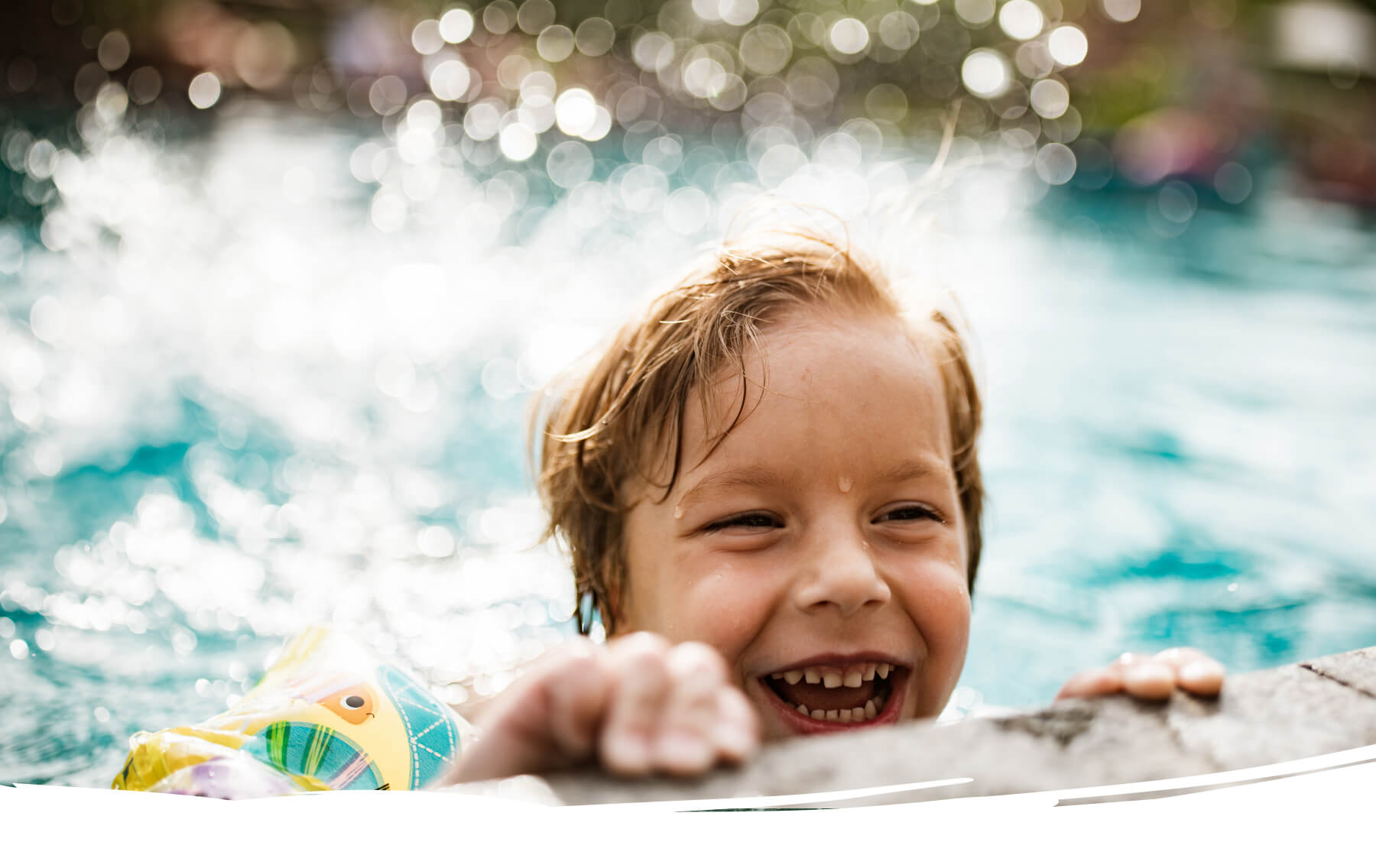 Happy boy enjoying pool